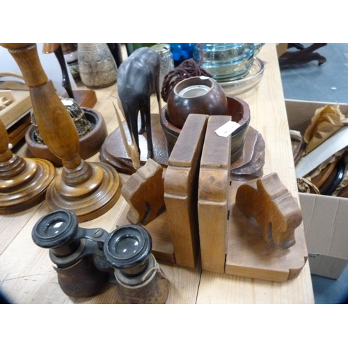 119 - Wood and treen to include candlesticks, bookends, Art Deco-style figure, bowls, stands, spoons, orie... 