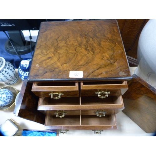 127 - Burr walnut apprentice cabinet with carry handles and doors enclosing fitted drawers.