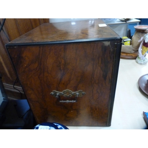 127 - Burr walnut apprentice cabinet with carry handles and doors enclosing fitted drawers.