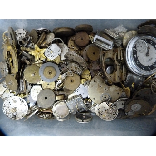 140 - Two boxes containing miscellaneous watch parts, movements, pocket watch parts, glass dial covers, ca... 