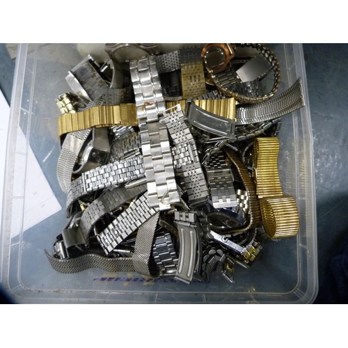 144 - Two boxes containing a large collection of stainless steel, rolled gold and other watch straps.