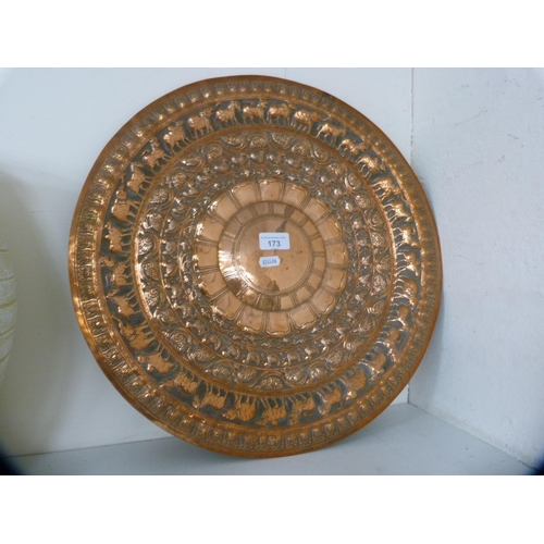 173 - Indian-style copper embossed charger.