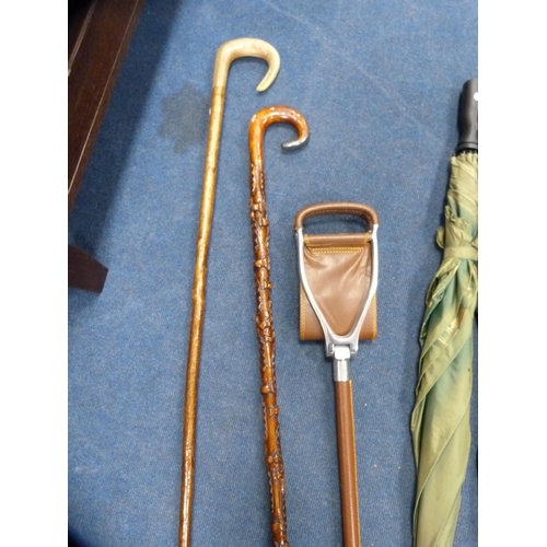 2 - Group of walking sticks to include a shooting stick, also umbrellas, a CD rack and a split cane fish... 