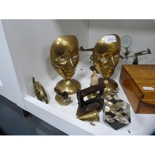 204 - Glass paperweights, inlaid box, brass ornaments, flat iron etc (one shelf).