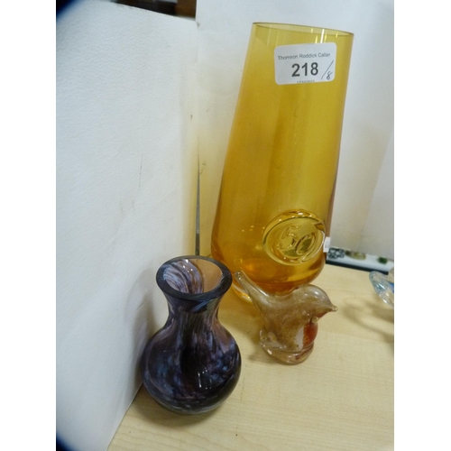 218 - Glassware to include an amber glass vase, Caithness-style glass vase, cylindrical art glass vase, mo... 