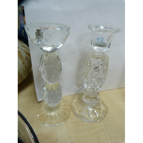 220 - Three glass decanters, cut glass candlesticks, paperweight and a glass dish.