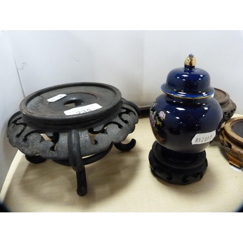 235 - Group of oriental hardwood vase stands, bowl and a modern Japanese vase and cover.