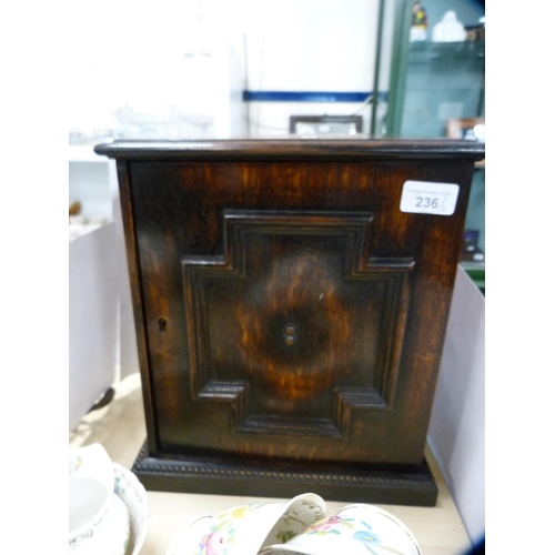 236 - Oak apprentice-style cupboard and a tray decorated with fruit and vines.  (2)