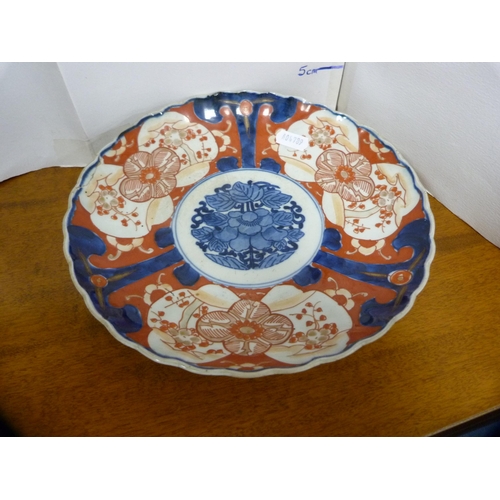 245 - Five pieces of antique Japanese Imari to include a bottle vase, plate, cylindrical vase and bowl.