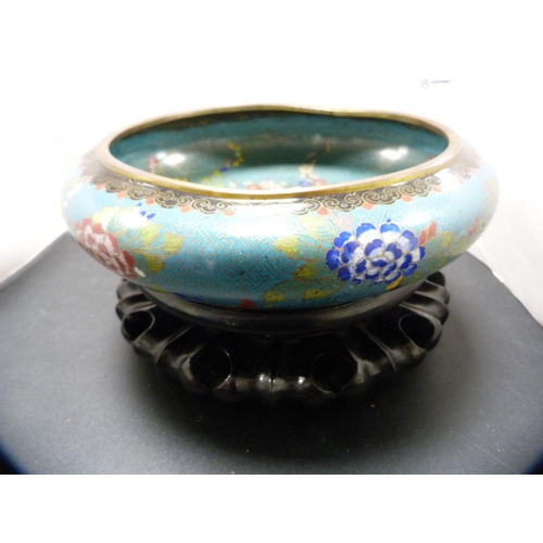 250 - Chinese cloisonné bowl on turquoise ground, 20th century, on an oriental hardwood stand.