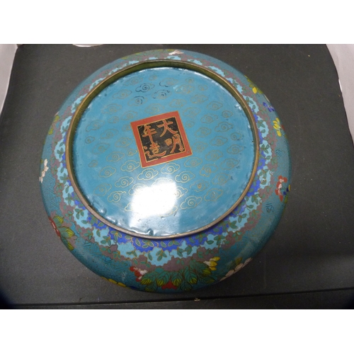 250 - Chinese cloisonné bowl on turquoise ground, 20th century, on an oriental hardwood stand.