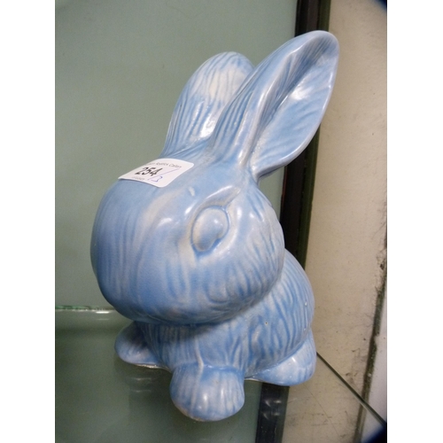 254 - Wade Heath blue glazed rabbit figure and two others, similar.  (3)