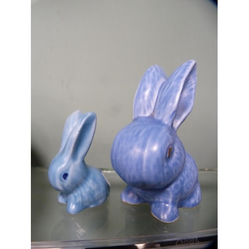 254 - Wade Heath blue glazed rabbit figure and two others, similar.  (3)