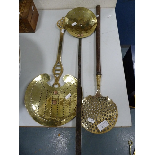 26 - Group of brass kitchenalia and utensils to include skimmers, ladles etc.