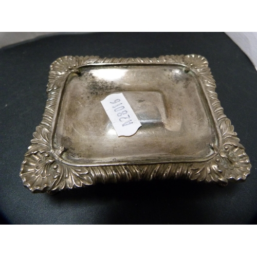 274 - Silver stand and a silver ashtray, 130g gross, also an unmarked white metal vesta sleeve, pin dish a... 