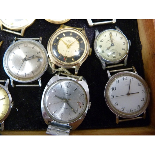 353 - Quantity of manual wind and automatic watch heads contained in a small display case to include Smith... 