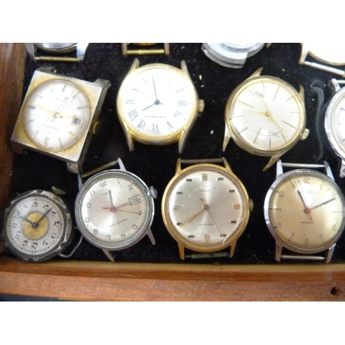 353 - Quantity of manual wind and automatic watch heads contained in a small display case to include Smith... 