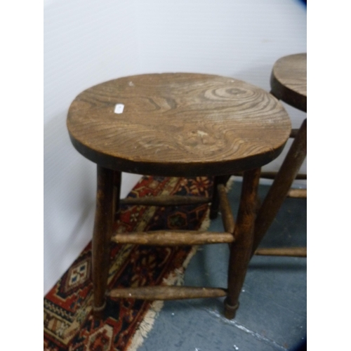 396 - Pine open carver chair and two farmhouse-style kitchen stools.  (3)