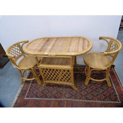 403 - Modern bamboo-effect conservatory D-end table and two chairs, and a Stressless-style foot stool.