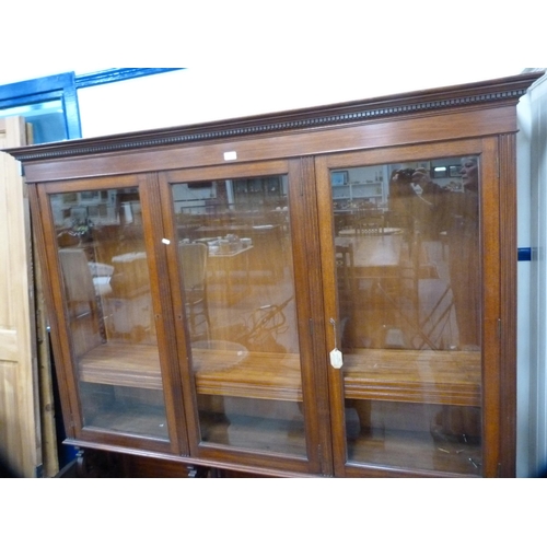 410 - Edwardian glazed three-door bookcase fixed to a converted base.