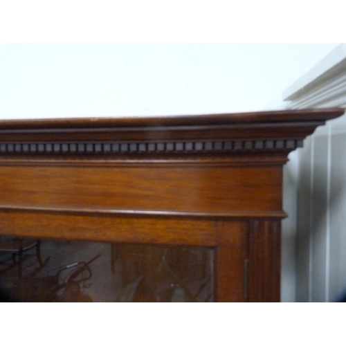 410 - Edwardian glazed three-door bookcase fixed to a converted base.