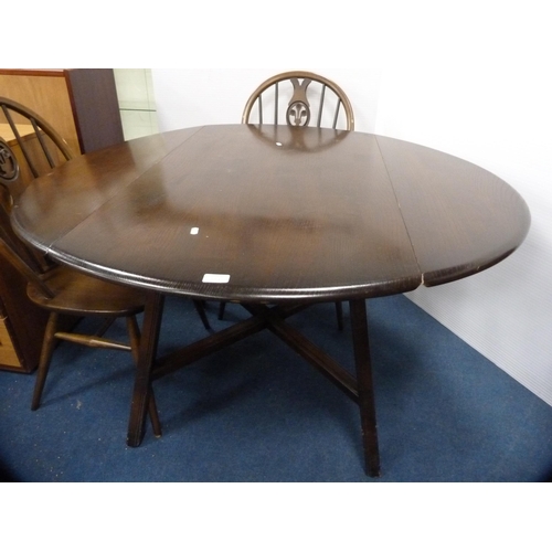 471 - Ercol drop-leaf dining table and a set of four wheel-back spindle chairs.  (5)