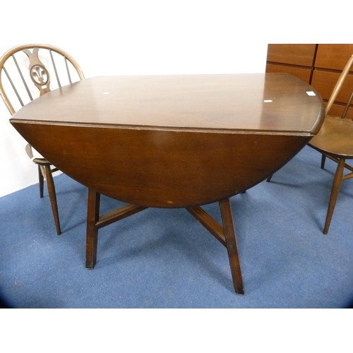 471 - Ercol drop-leaf dining table and a set of four wheel-back spindle chairs.  (5)