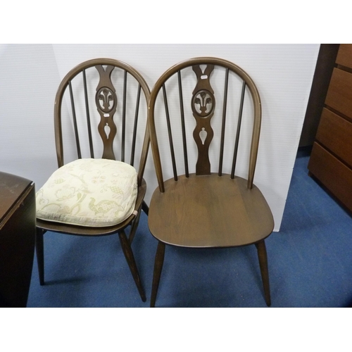 471 - Ercol drop-leaf dining table and a set of four wheel-back spindle chairs.  (5)