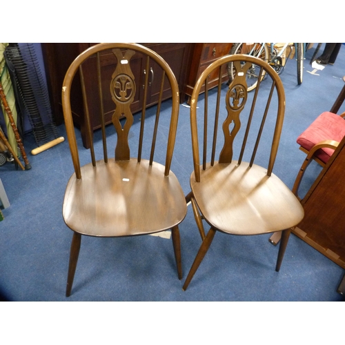 471 - Ercol drop-leaf dining table and a set of four wheel-back spindle chairs.  (5)