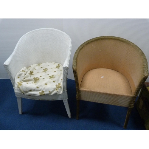 486 - Two woven fibre tub chairs and a modern oval occasional table.  (3)