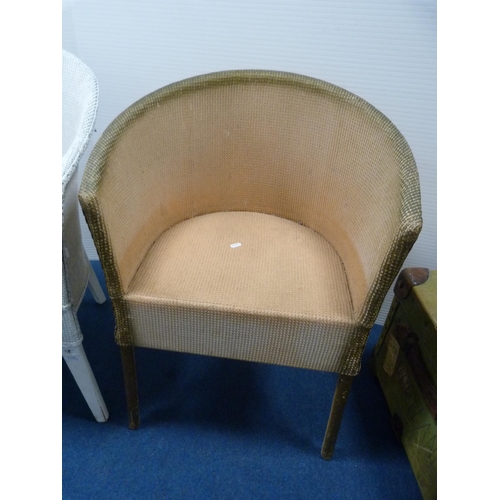 486 - Two woven fibre tub chairs and a modern oval occasional table.  (3)