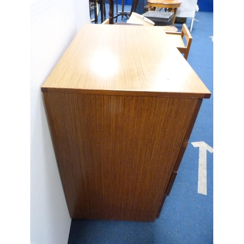 493 - Retro teak chest of four drawers.