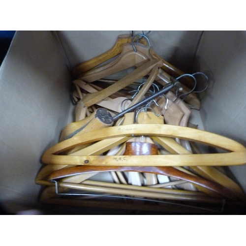 56 - Two cartons containing vintage coat hangers, shoe stretchers, fabrics, napery etc.