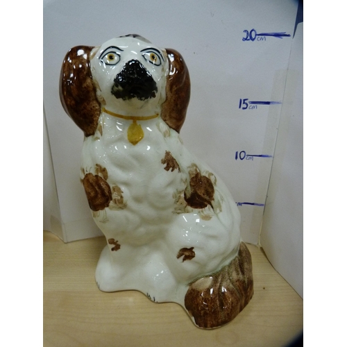 58 - Pair of pottery spaniel dog figures with painted eyes.