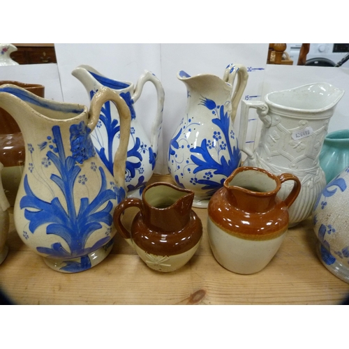 85 - Group of Victorian Glasgow-style jugs, Victorian relief decorated jugs, water jug with pewter lid et... 