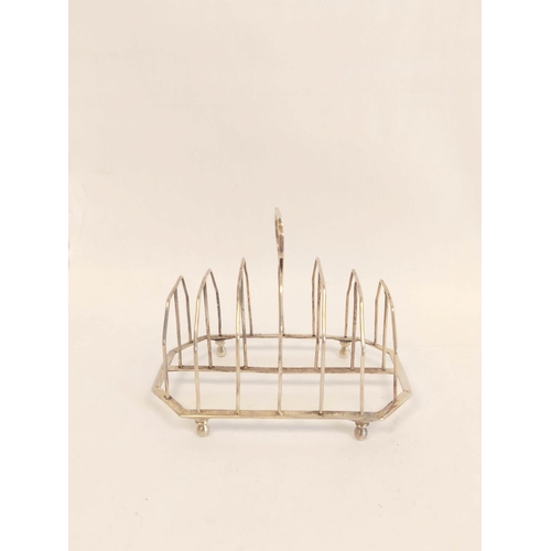 44 - Silver toast rack for six with plain wires and angled handle and base on bun feet by S Hennell, 1805... 