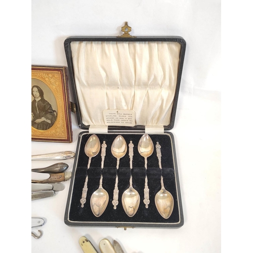 56 - Set of six silver teaspoons cased, another enamelled, various fruit and penknives, some with silver ... 