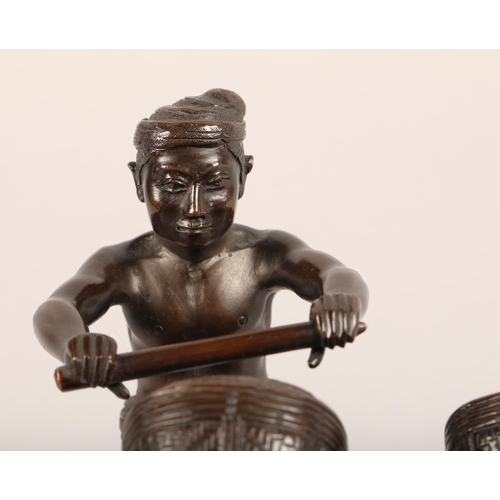 284 - Oriental bronze figure, mounted to a hardwood stand, height 17cm