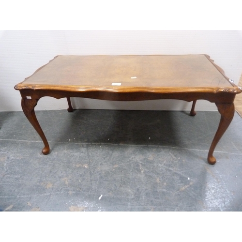 521 - Walnut long-john style coffee table with glass top.