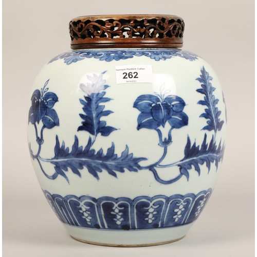 262 - 19th century Chinese blue and white ginger jar, with carved hardwood cover, the jar decorated with a... 