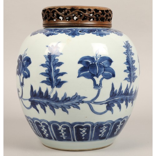 262 - 19th century Chinese blue and white ginger jar, with carved hardwood cover, the jar decorated with a... 