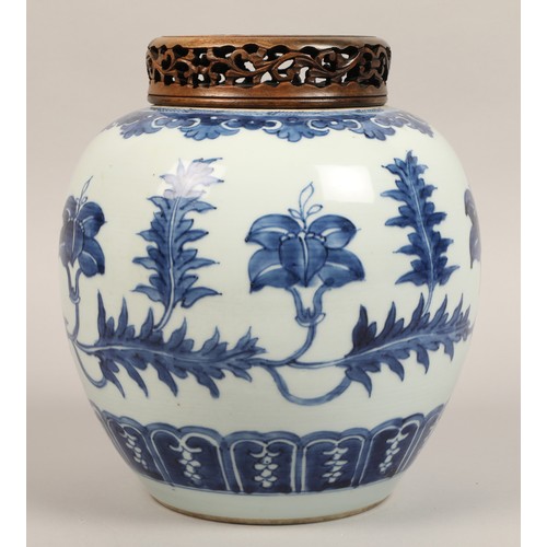 262 - 19th century Chinese blue and white ginger jar, with carved hardwood cover, the jar decorated with a... 