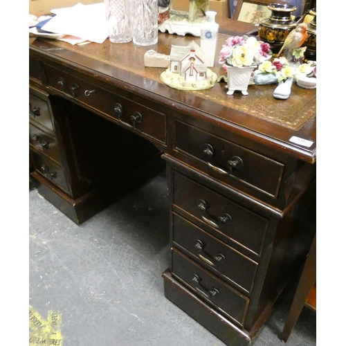 516 - Reproduction leather top pedestal desk fitted with nine drawers.