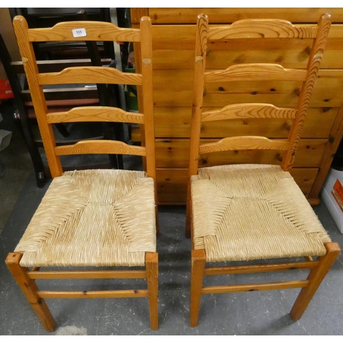 535 - Two pine ladder back chairs