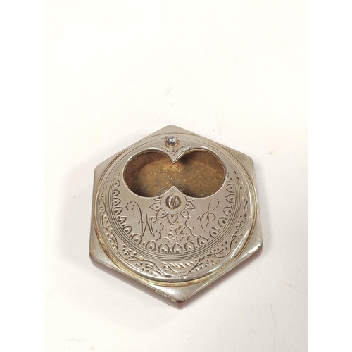 168 - Antique white metal and resin pocket snuff box, the engraved hexagonal revolving top in the form of ... 