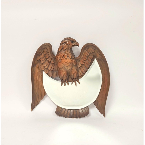 174 - Black Forest style carved wood wall mirror in the form of an eagle above crescent shaped mirror, 38c... 