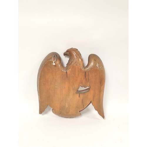 174 - Black Forest style carved wood wall mirror in the form of an eagle above crescent shaped mirror, 38c... 