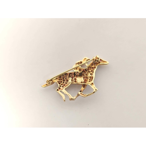 75 - 9ct gold racehorse and jockey brooch set with eight-cut diamonds. 6.6g