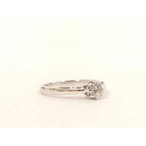 81 - Diamond solitaire ring in 18ct white gold. Size 'K' 2.1g.