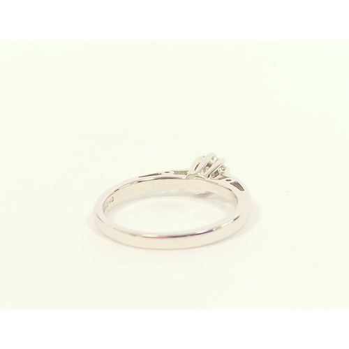 81 - Diamond solitaire ring in 18ct white gold. Size 'K' 2.1g.